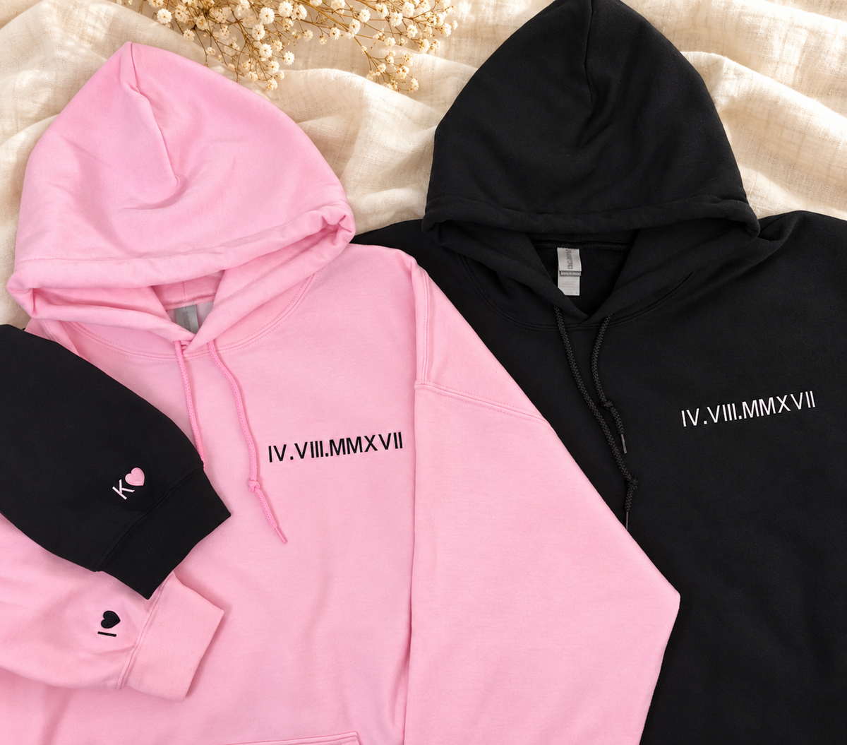 Pink and black Roman numeral anniversary hoodies with initial and heart cuff embroidery