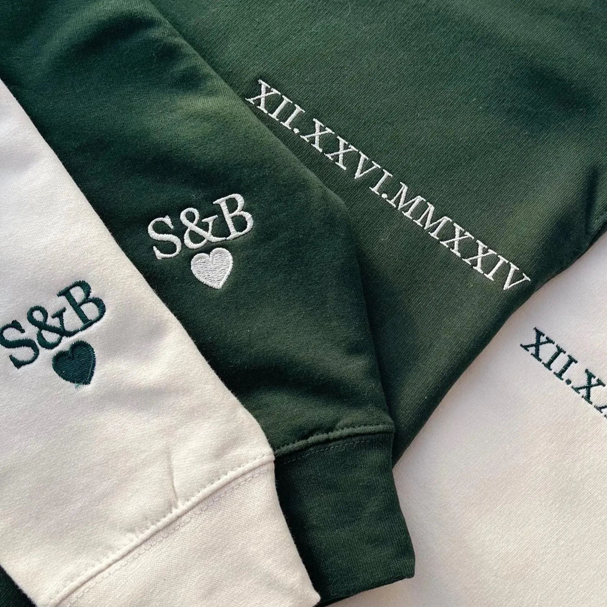 Close-up of anniversary date embroidery and S and B heart cuff design