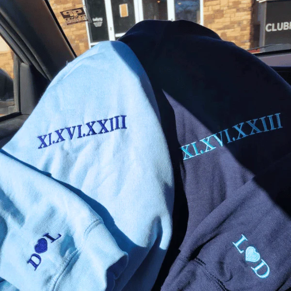 Light blue and navy hoodies with date embroidery and heart initials