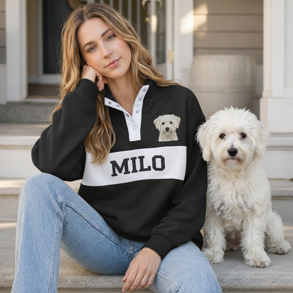 Black Milo pet portrait snap pullover worn beside a white dog