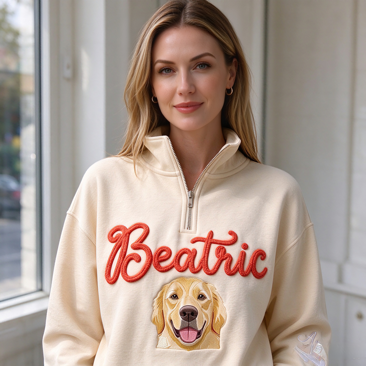 Model wearing cream Beatric pet portrait quarter zip indoors
