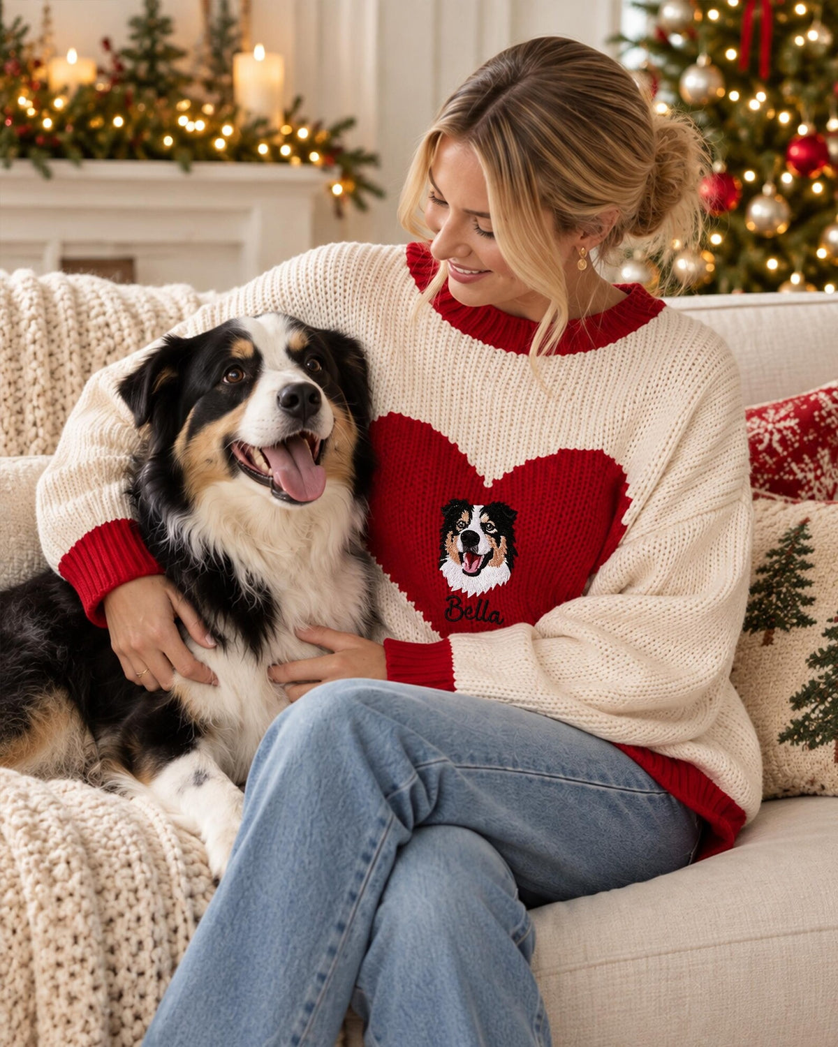 Woman wearing personalized heart pet knit sweater while cuddling her dog