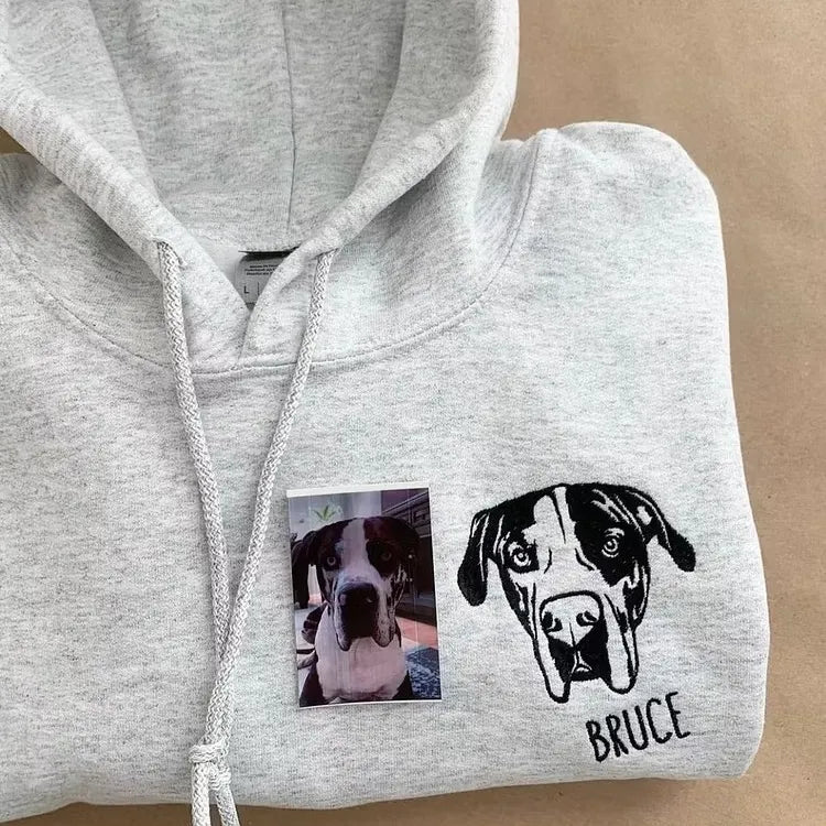 Gray hoodie with a black line art Great Dane portrait and the name Bruce, next to the dog's photo