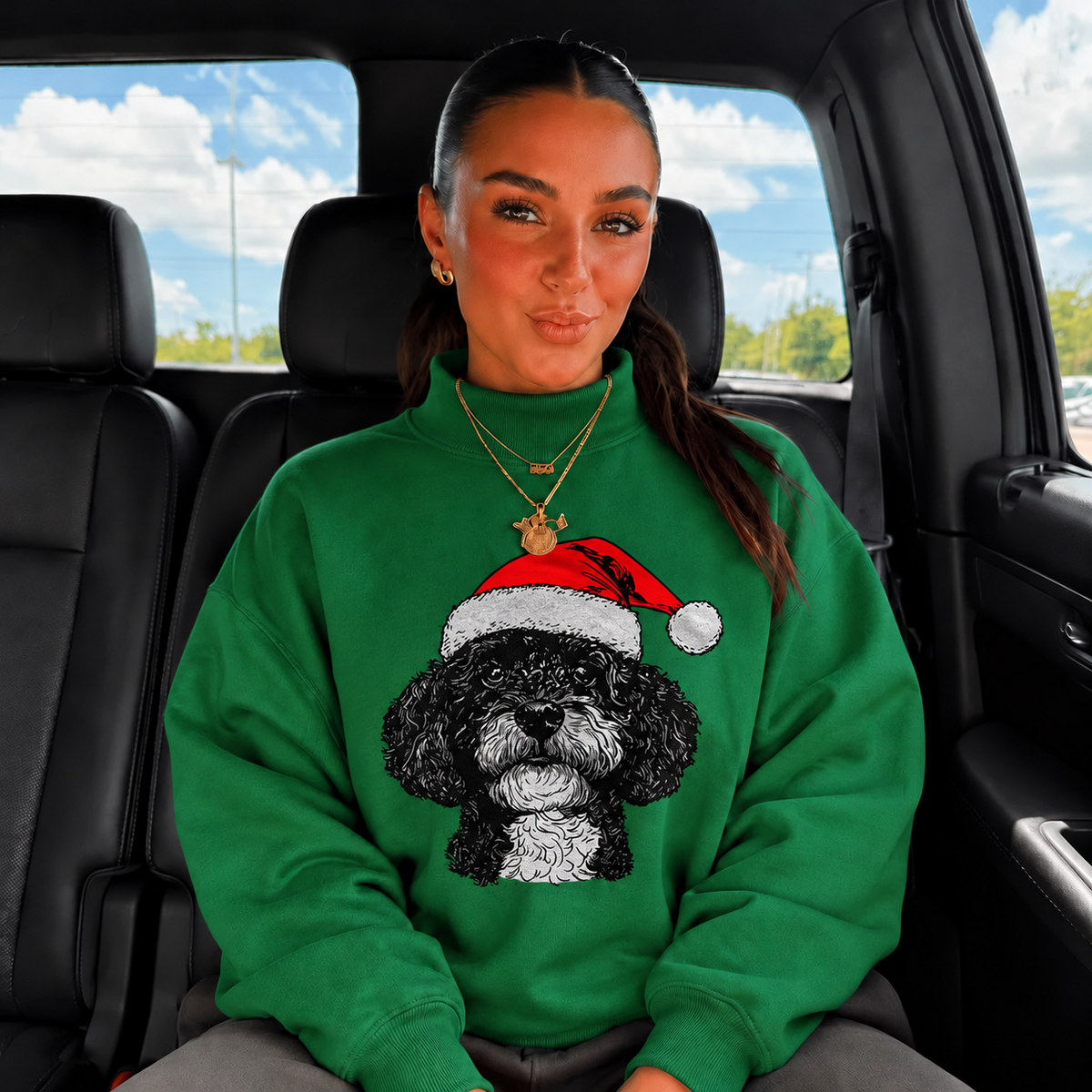 Green mockneck sweatshirt with black curly dog and red Santa hat print