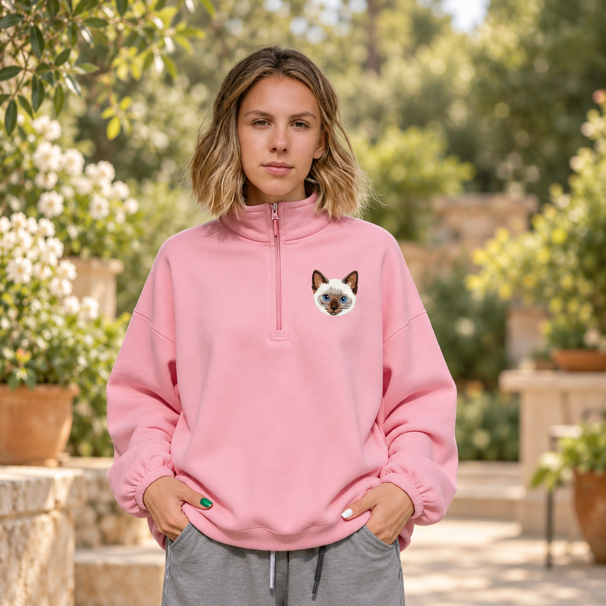 Adult pink quarter-zip pullover with custom embroidered Siamese cat portrait