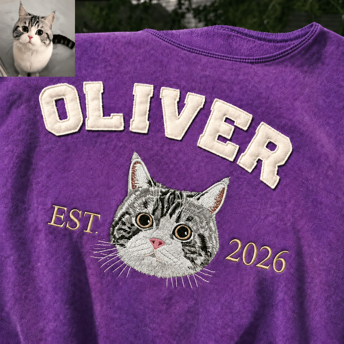 Purple OLIVER cat portrait sweatshirt close-up with a label-free neckline