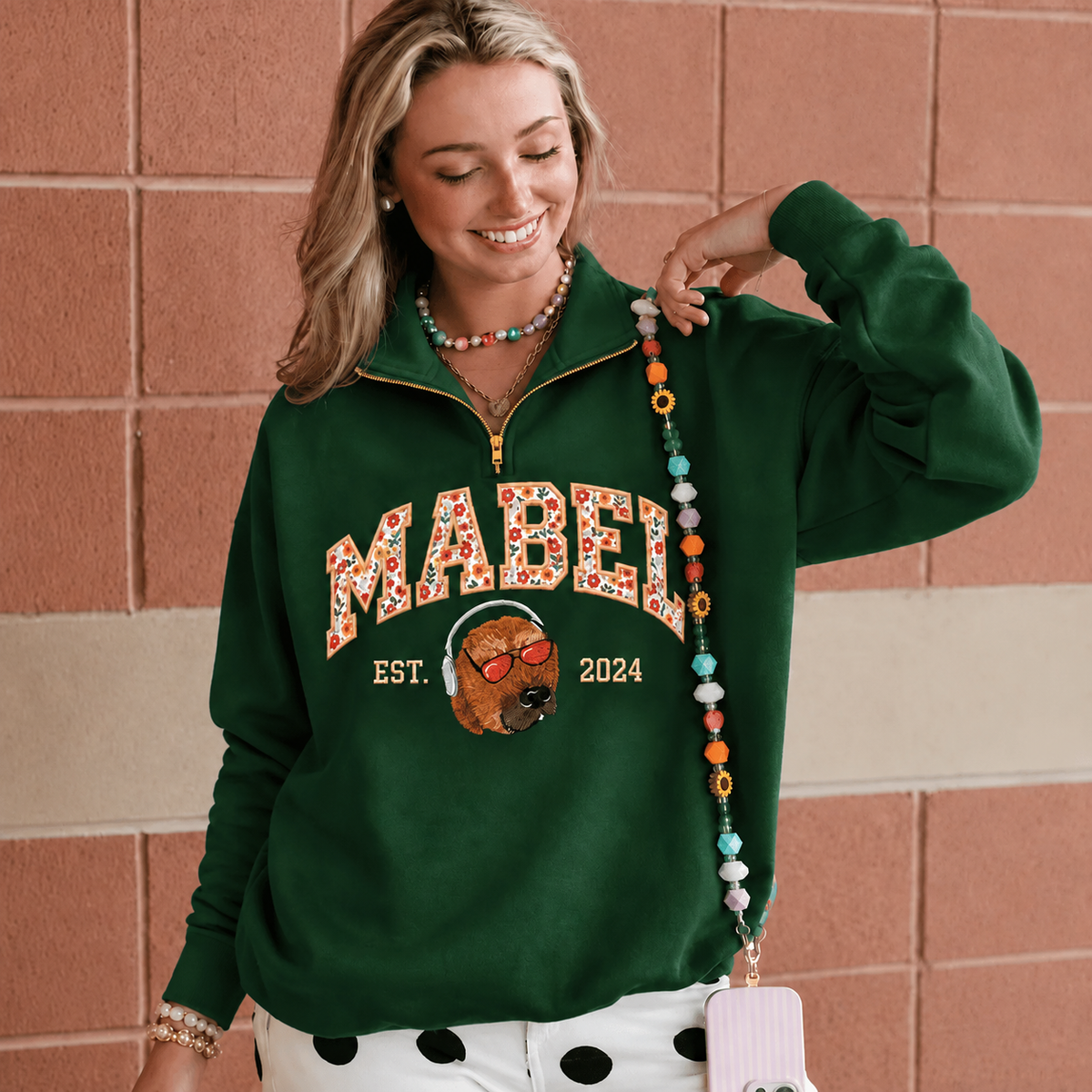Female model wearing forest green MABEL pet portrait quarter-zip sweatshirt