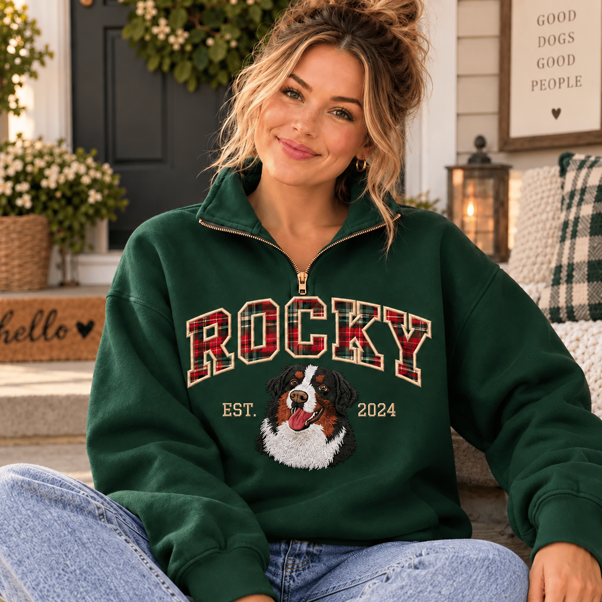 Female model wearing forest green ROCKY plaid applique pet portrait quarter-zip sweatshirt