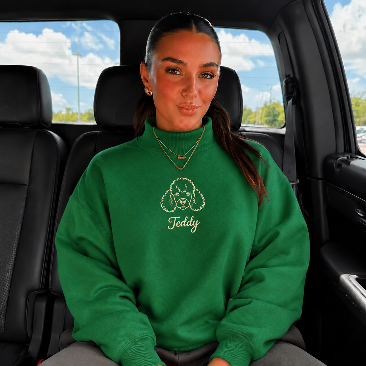 Green mockneck sweatshirt with Teddy poodle outline and cream script name
