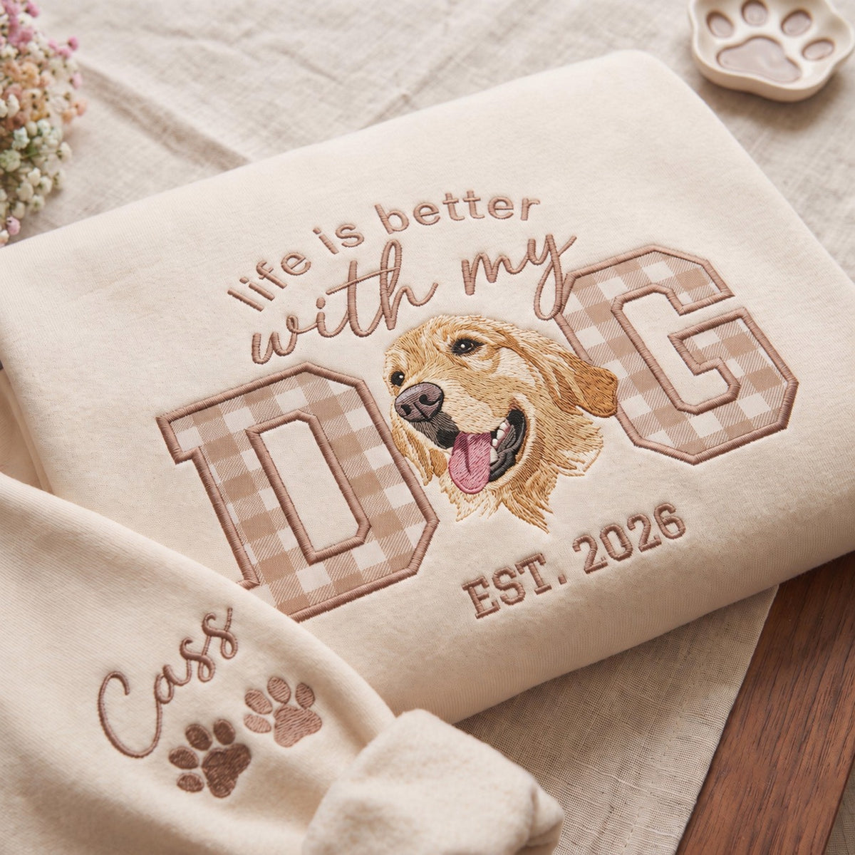 Close-up of dog portrait embroidery and tan gingham applique lettering