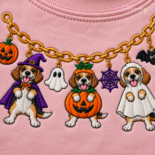 Close-up of Beagle Halloween charm necklace embroidery on pink sweatshirt