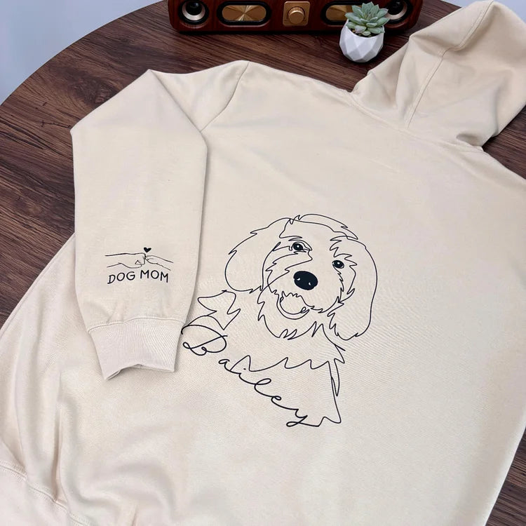 Cream pet sketch sweatshirt with sleeve design laid flat