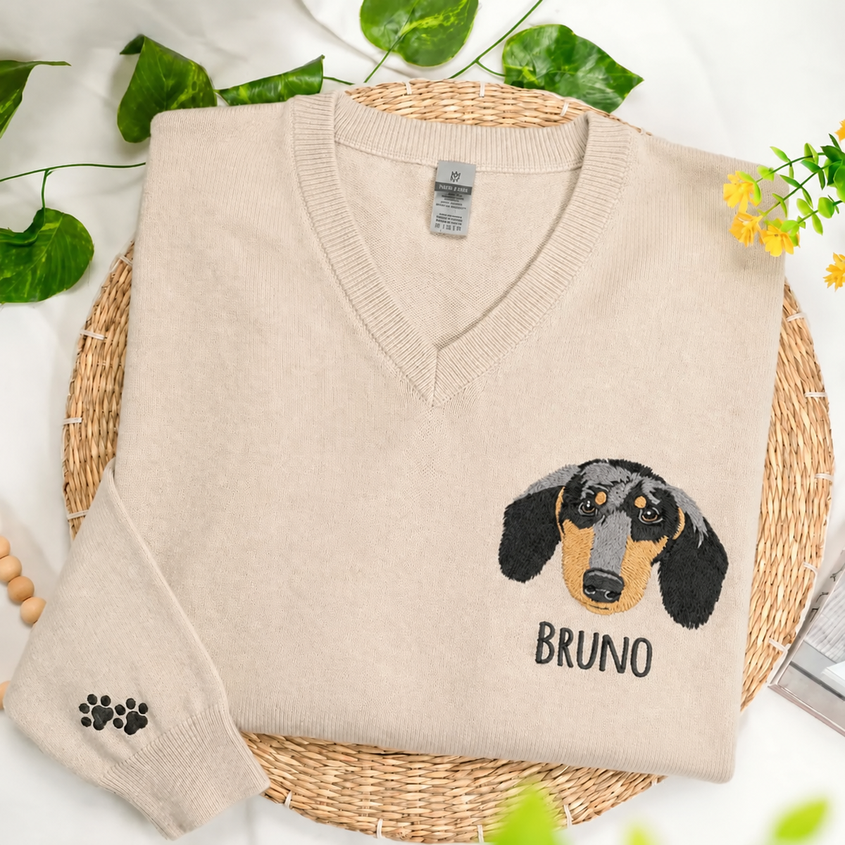 Beige Bruno dachshund portrait V-neck sweater with paw sleeve detail