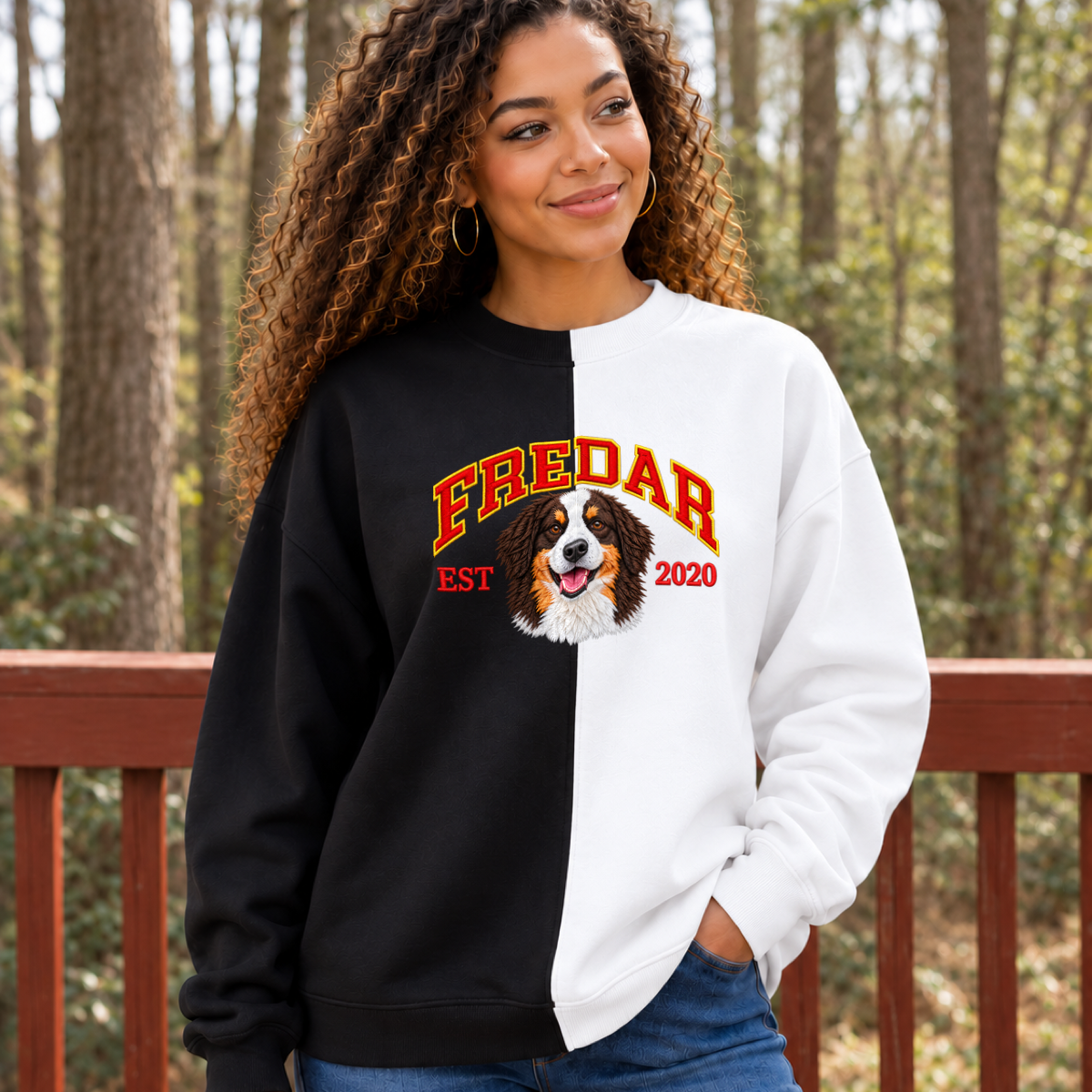 Model wearing black and white split color pet portrait sweatshirt with FREDAR varsity name and EST 2020
