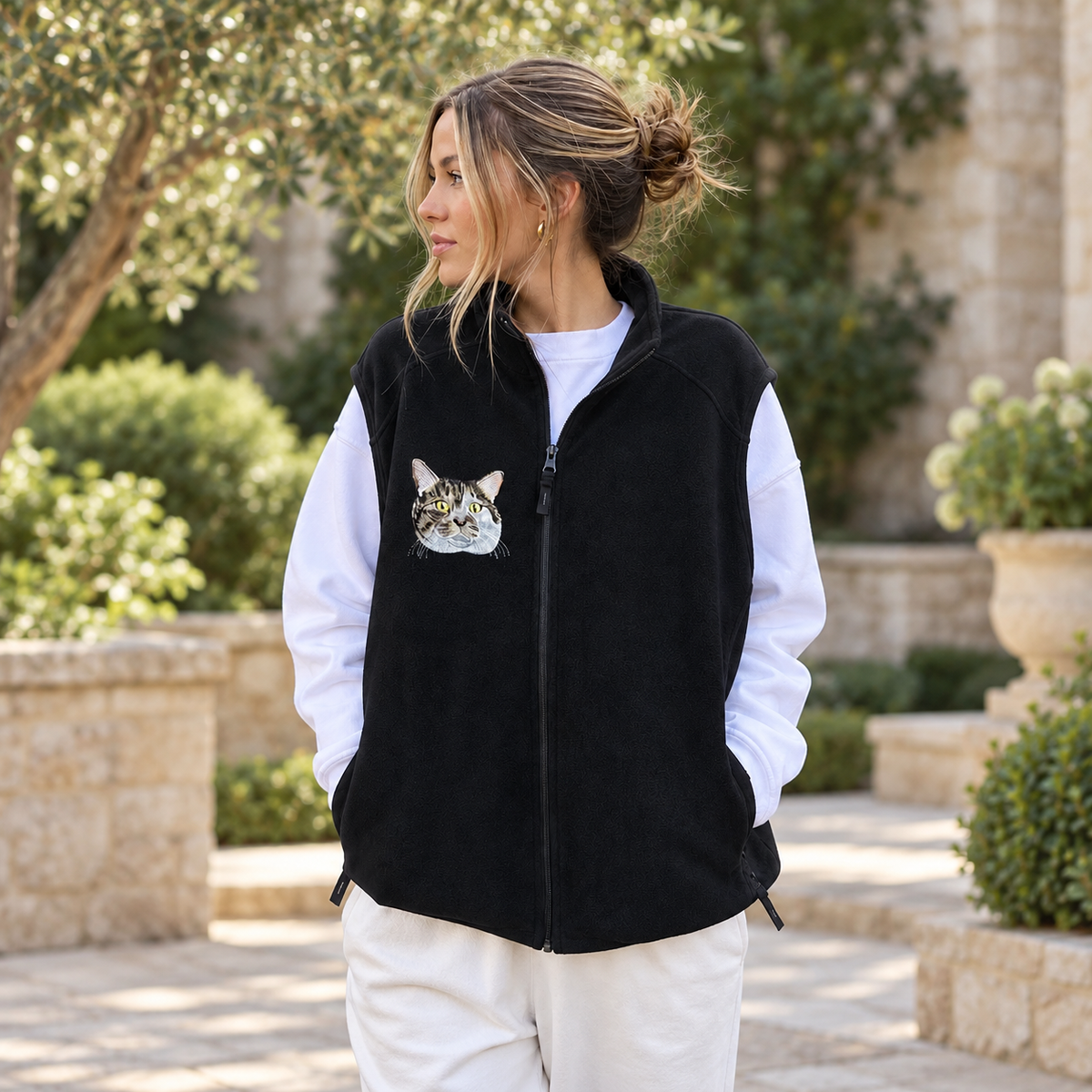 Black fleece zip-up vest with a custom embroidered cat portrait