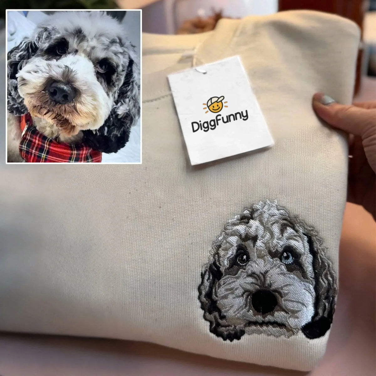 Gray poodle mix face embroidered in detailed black and gray thread on a sand sweatshirt