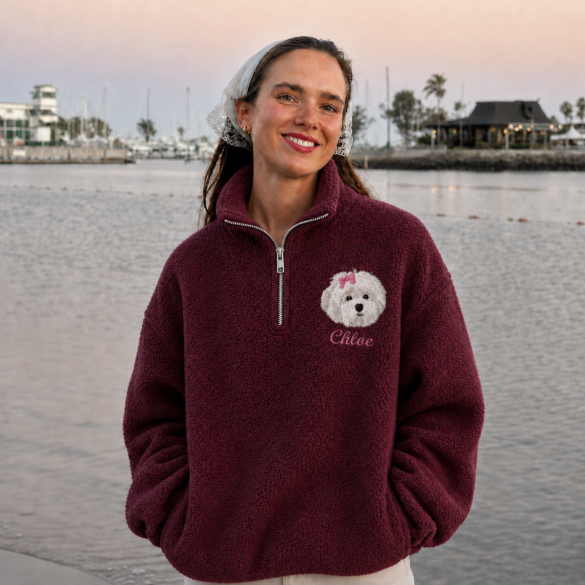 Model wearing burgundy fleece quarter zip outdoors