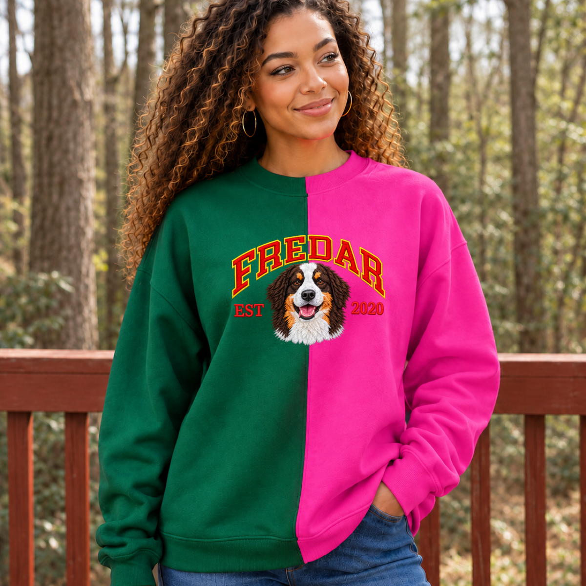 Model wearing green and magenta split color pet portrait sweatshirt with FREDAR varsity name and EST 2020