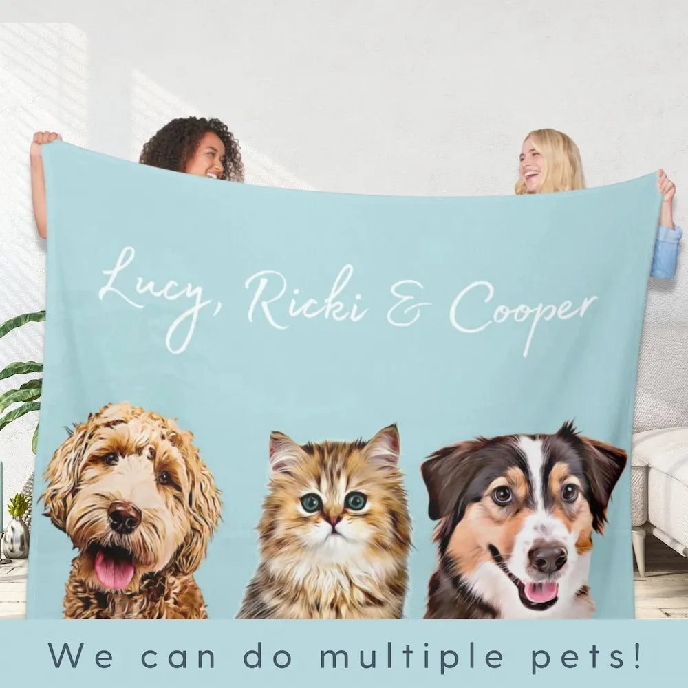 Blue blanket with three pet portraits and Lucy, Ricki and Cooper names