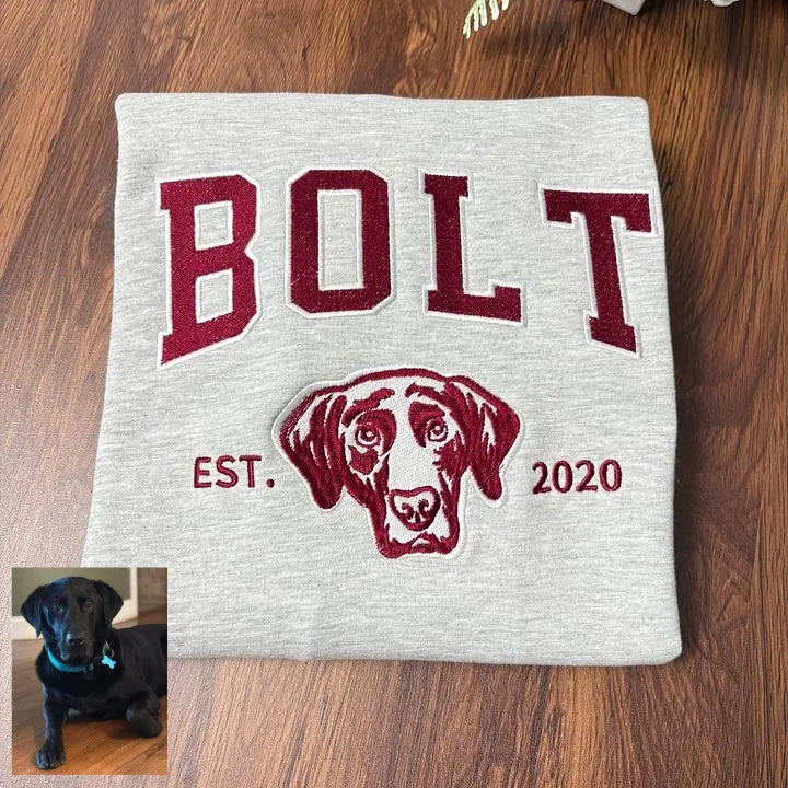 Gray sweatshirt with BOLT in maroon varsity letters above an embroidered Labrador outline, with the original photo