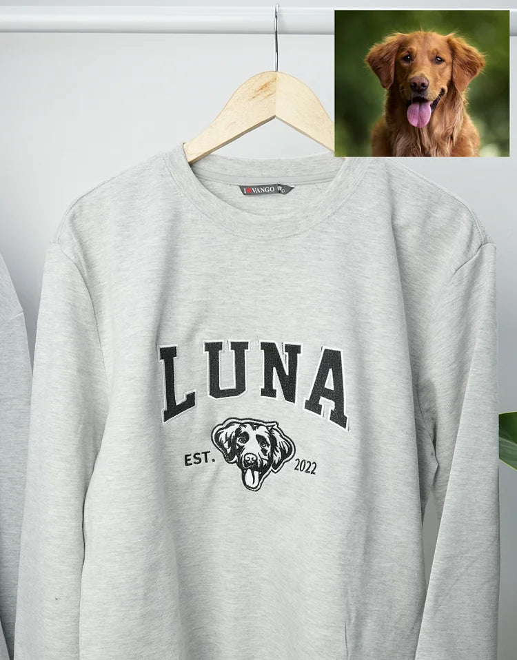 Light gray sweatshirt with LUNA in black varsity letters and a small dog outline, with the original photo