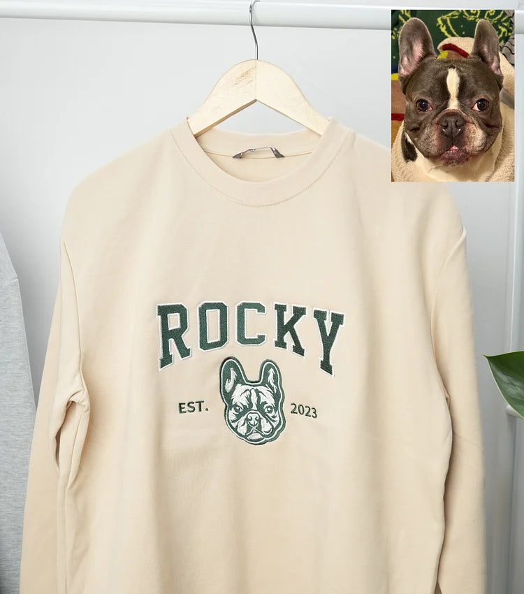 Cream sweatshirt with ROCKY in green letters above a French bulldog outline, with the original photo