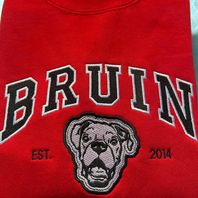 Red sweatshirt with BRUIN in black varsity letters above a gray and black boxer outline