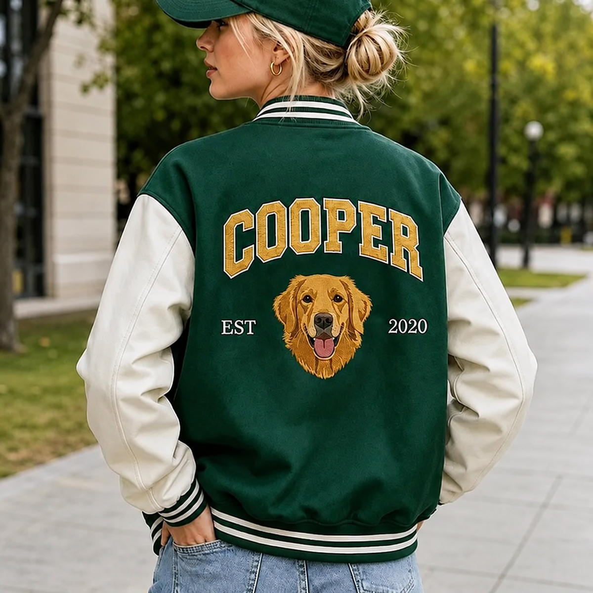 Model wearing green Cooper pet portrait varsity jacket with ivory sleeves